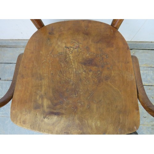 735 - An antique bentwood elbow chair/desk chair in the manner of Thonet, the seat with pokerwork decorati... 