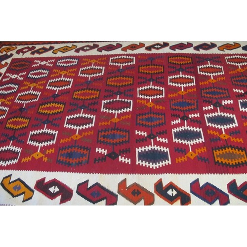 851 - South west Persian Qashqai Kilim repeat central pattern on red and cream ground.  285cm x 165cm appr... 