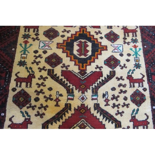 853 - North East Persian Meshed Belouch rug.  Various central pattern/motifs with stylized animals on crea... 