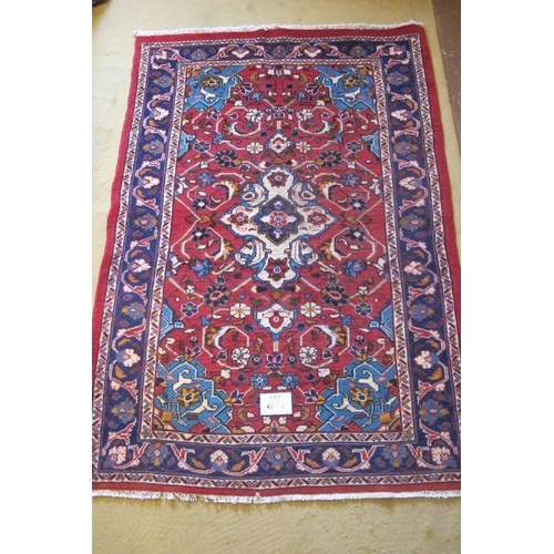 856 - North West Persian Mahal rug, central motif on cream ground surrounded by a floral design and wide b... 