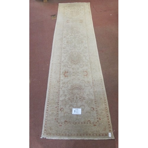 866 - A mid-late 20th Century cream ground runner with a subtle pattern and border.  299cm x 77cm approx.
... 