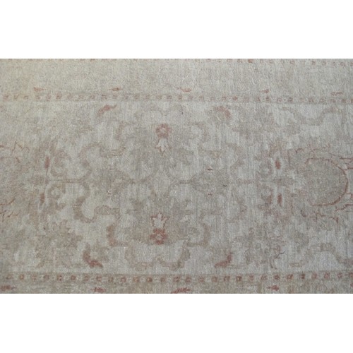 866 - A mid-late 20th Century cream ground runner with a subtle pattern and border.  299cm x 77cm approx.
... 