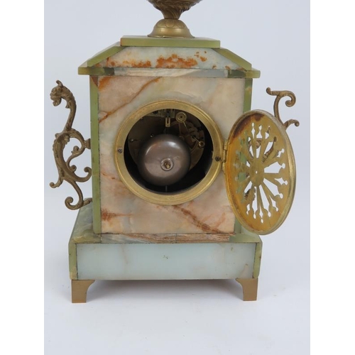 104 - An early 20th Century French green onyx mantel clock, with gilt metal mounts. Height 46cm.
Condition... 