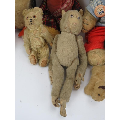 110 - Eight mixed vintage cuddly toys including a monkey, penguin, panda, dogs and three bears.  Tallest 4... 