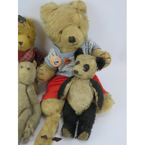 110 - Eight mixed vintage cuddly toys including a monkey, penguin, panda, dogs and three bears.  Tallest 4... 