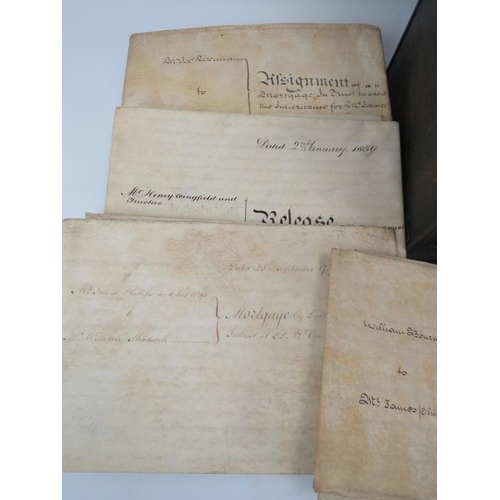 111 - A steel deed box full of 18th and 19th Century mortgages, indentures and other items.  Approx 25.
Co... 