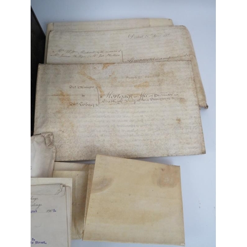 111 - A steel deed box full of 18th and 19th Century mortgages, indentures and other items.  Approx 25.
Co... 