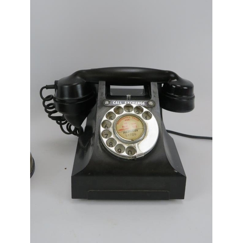 116 - Two vintage style telephones including a brass candlestick version and a black GPO 312F Model. (2 it... 