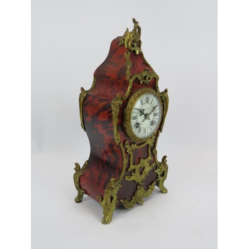 121 - A 19th Century French Boule tortoiseshell and Ormulu striking mantel clock with Marti Freres movemen... 