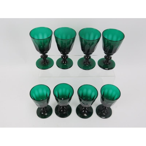 124 - A set of eight regency petal sliced Bristol green drinking glasses, each with polished pontils. Heig... 