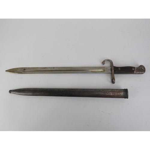 142 - A Modelo Argentino 1909 bayonet and scabbard. Ricasso marked ‘Weyerberg Kirschbaum and Co, Solingen’... 