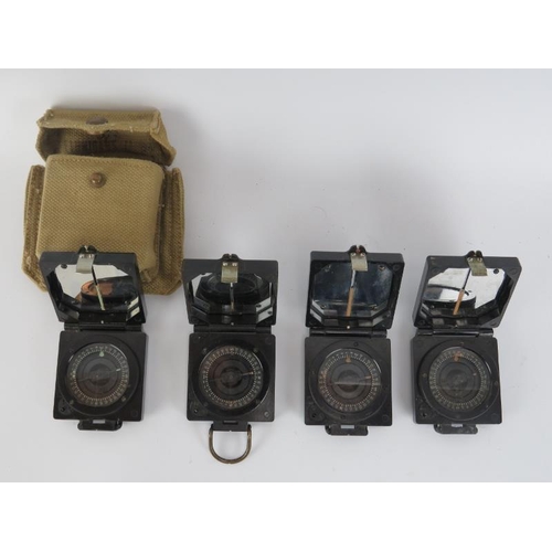 146 - A group of four vintage British Mark 1 Magnetic Marching compasses by T G Co Ltd. Each bearing broad... 