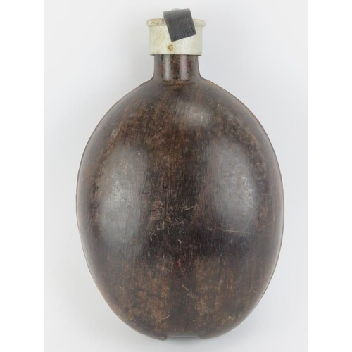 147 - A German Wehrmacht WWII era coconut canteen flask. Probably Africa Corps. Marked ‘D.R.G.M. – H.R.E. ... 