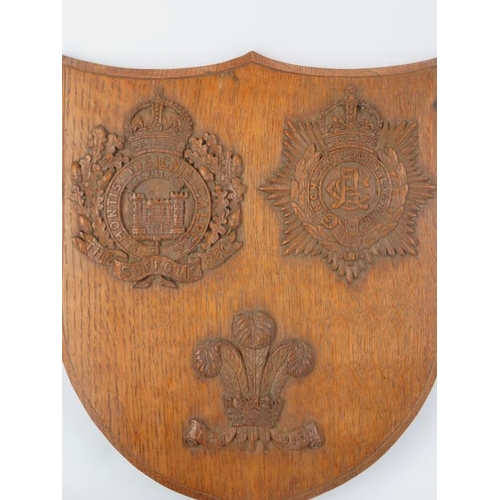 153 - A British Military ‘The Suffolk Regiment’ carved oak shield plaque and two Anglo-Indian British Mili... 