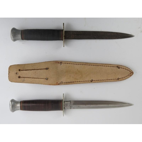 167 - Two British fighting knifes by William Rodgers of Sheffield, mid 20th century. One with leather shea... 