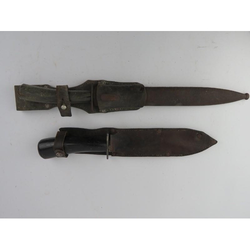 168 - Two German WWII era fighting knives both with horn handles. (2 items) 42.3 cm total length, 30.5 cm ... 