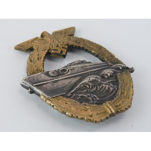 170 - A German WWII Kriegsmarine E-Boat Badge. 2nd Pattern design. 5.9 cm x 5 cm.
Condition report: Some a... 