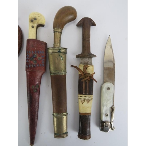 260 - A group of ten vintage knives, daggers and a tribal spear head. (11 items) Spear head: 35.3 cm lengt... 