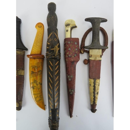 260 - A group of ten vintage knives, daggers and a tribal spear head. (11 items) Spear head: 35.3 cm lengt... 