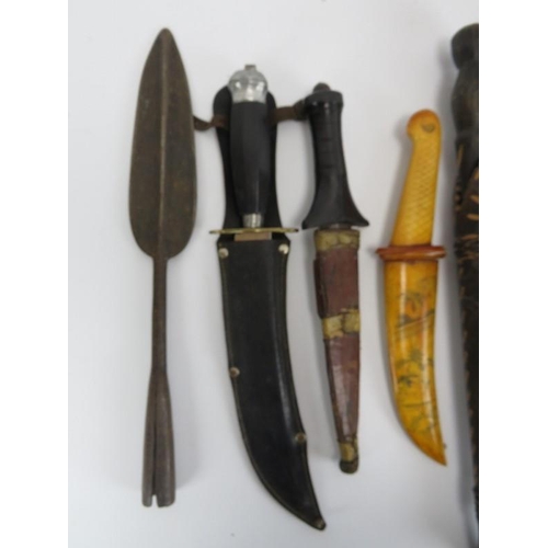 260 - A group of ten vintage knives, daggers and a tribal spear head. (11 items) Spear head: 35.3 cm lengt... 