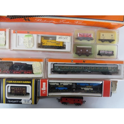 280 - A group of Arnold N Guage model trains, rolling stock and track with boxes. (Quantity)
Condition rep... 