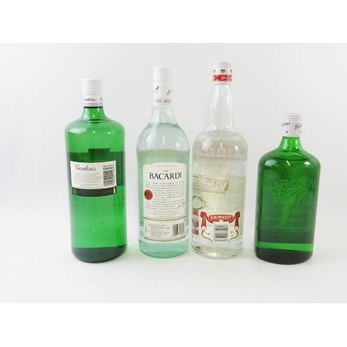 311 - 4 bottles: 1 litre bottle of Gordons gin, 100cl, 37.5%, 1 bottle of Gordons gin, 75cl, 40%; 1 litre ... 