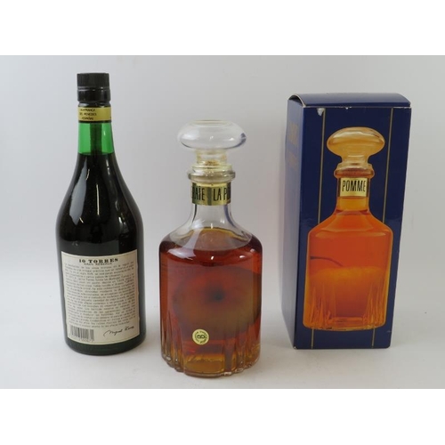 326 - 2 bottles: 1 boxed glass decanter of Calvados Pommeraie, 70cl, 40% vol; 1 bottle of Torres 10 year o... 