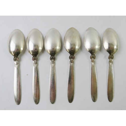 352 - Six Georg Jensen silver 'Cactus' design dessert spoons. Each bear Georg Jensen mark and stamped STER... 