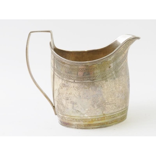 356 - A fine George III silver cream jug in particularly good condition, with engraved borders and blank l... 