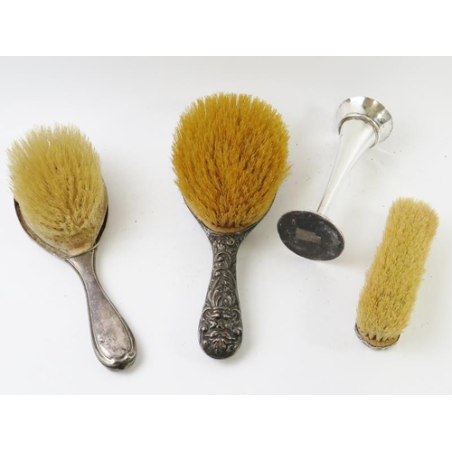 364 - Three antique silver backed brushes and a silver trumpet vase. Various hallmarks and makers. Vase he... 