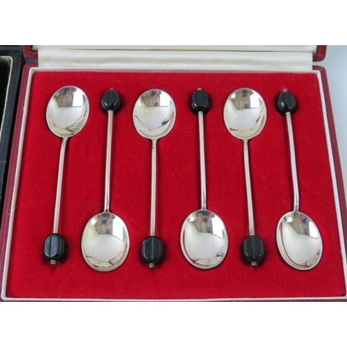 383 - Two cased sets of silver coffee bean teaspoons. One Mappin & Webb, hallmarked for Sheffield 1918 and... 