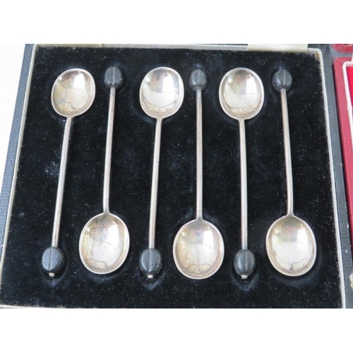 383 - Two cased sets of silver coffee bean teaspoons. One Mappin & Webb, hallmarked for Sheffield 1918 and... 