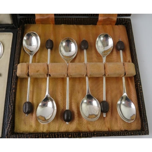 385 - Two cased sets of silver coffee bean teaspoons. Hallmarked for Birmingham 1921 and Sheffield 1939. A... 