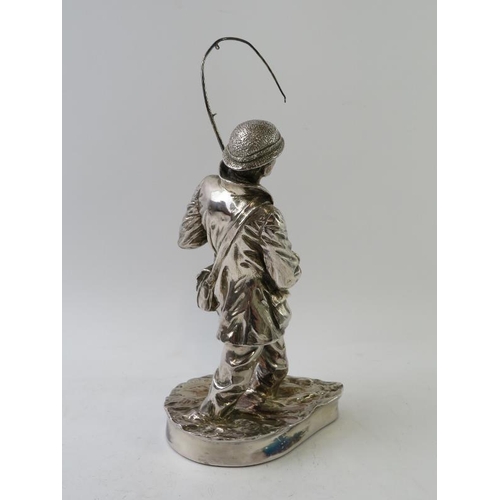 389 - A hallmarked silver model of a fly fisherman, signed R Chadwick. Hallmarked for Sheffield 1986, make... 