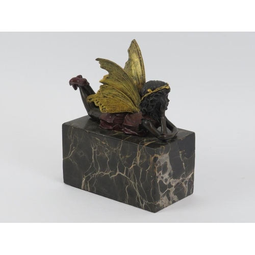 4 - A vintage gilt and cold painted bronze model of a fairy modelled on a marble plinth. 16 cm height.
C... 