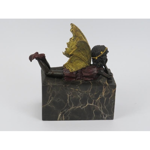 4 - A vintage gilt and cold painted bronze model of a fairy modelled on a marble plinth. 16 cm height.
C... 