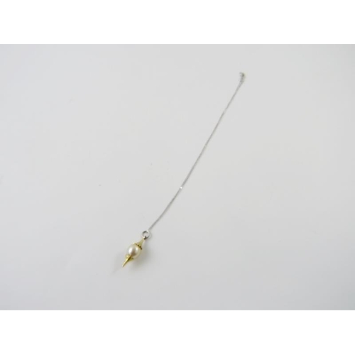 417 - A cultured pearl pendant, the golden pearl approx 10.50 - 11.00mm diameter with textured satin yello... 