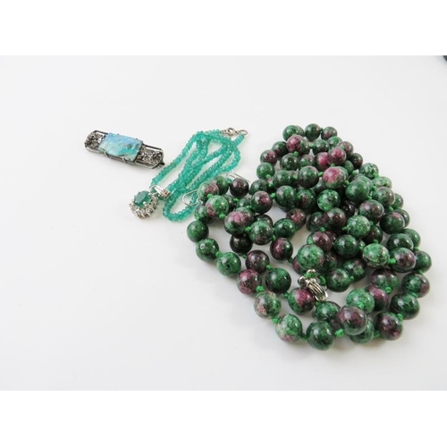 432 - A long bead necklace of ruby and zoisite beads 135cm long; a faceted chrysoprase green bead necklace... 