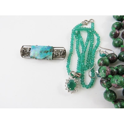 432 - A long bead necklace of ruby and zoisite beads 135cm long; a faceted chrysoprase green bead necklace... 