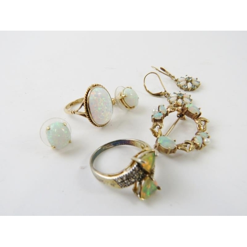 438 - A 9ct yellow gold brooch set with opals and seed pearls; and other opal or synthetic  opal items to ... 