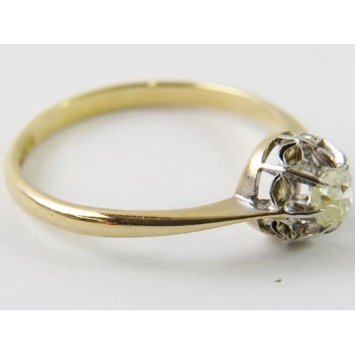 442 - A single stone diamond ring claw set in illusion setting in white and yellow metals, shank stamped ‘... 