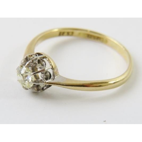 442 - A single stone diamond ring claw set in illusion setting in white and yellow metals, shank stamped ‘... 