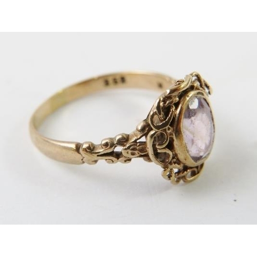 462 - A decorative vintage rose metal and amethyst ring stamped 9ct, 2.4gms approx  a/f  wear to setting a... 