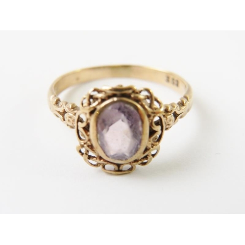 462 - A decorative vintage rose metal and amethyst ring stamped 9ct, 2.4gms approx  a/f  wear to setting a... 