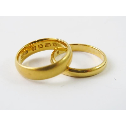 463 - Two 22ct yellow gold wedding bands,  5mm wide hallmarked London 1927 size K; and 3mm wide hallmarked... 