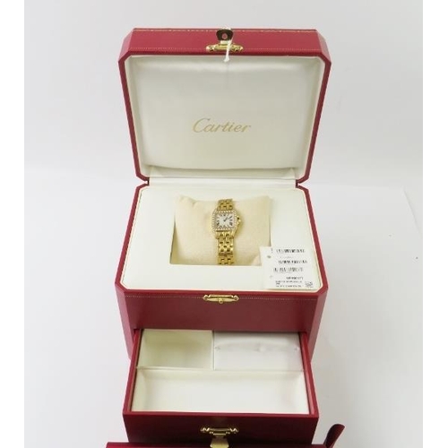 485 - Cartier - A lady’s 18ct gold and diamond Santos Demoiselle quartz bracelet watch, c.2009, model 2699... 