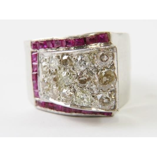 488 - A retro 1940’s diamond and ruby Tank ring, with a raised panel pave set with old round cut diamonds ... 