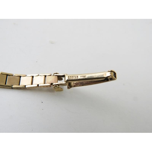 499 - A 9ct yellow gold lady’s mechanical wind wristwatch with textured gold link bracelet strap, hallmark... 