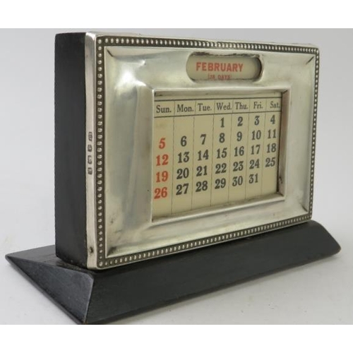 52 - A 1920s silver mounted ebonised perpetual desk calendar, hallmarked for Birmingham 1929. Height 9cm,... 