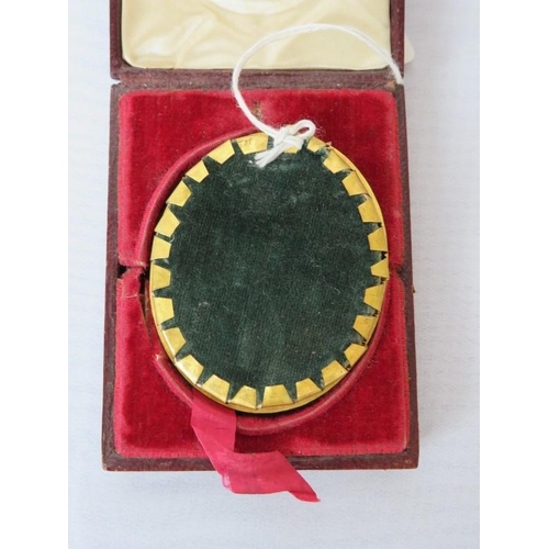 534 - A leather boxed late 19th/20th Century portrait miniature mounted in an oval frame.  Study of a gent... 